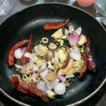 Grilling The Curry Paste For Aeb Gai