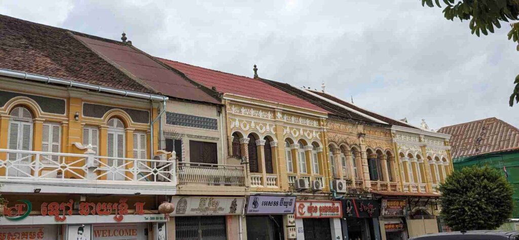 Colonial French architecture street with colorful buildings and local shops in Krong Battambang, Cambodia