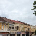 Colonial French architecture street with colorful buildings and local shops in Krong Battambang, Cambodia