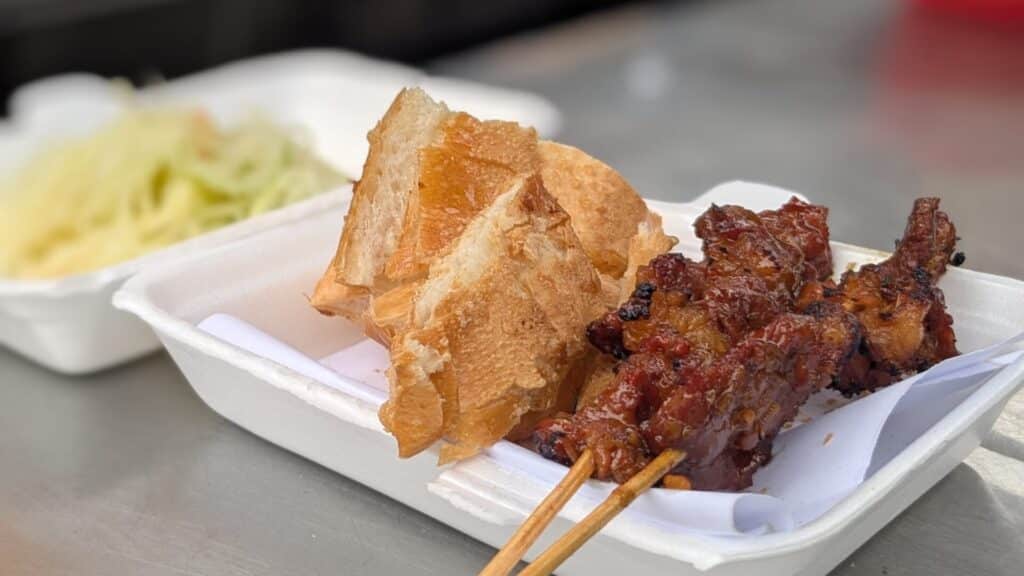 Grilled Cambodian BBQ beef skewers with pickled papaya