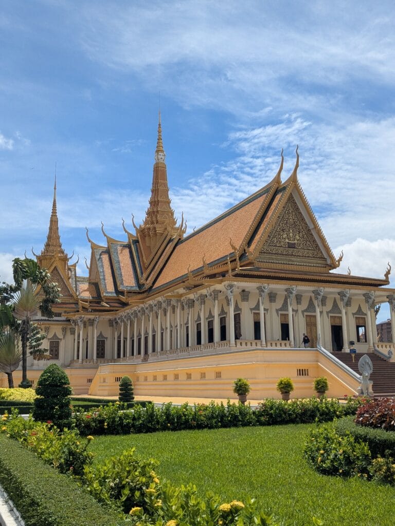 The Royal Palace in Phnom Penh with golden spires under a bright sky.
